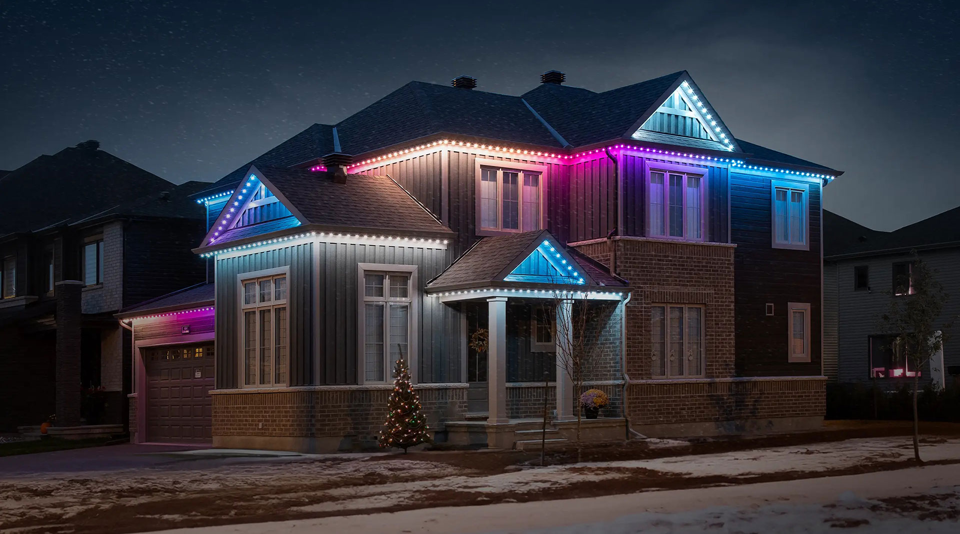 A string of lights illuminates the bustle of a street